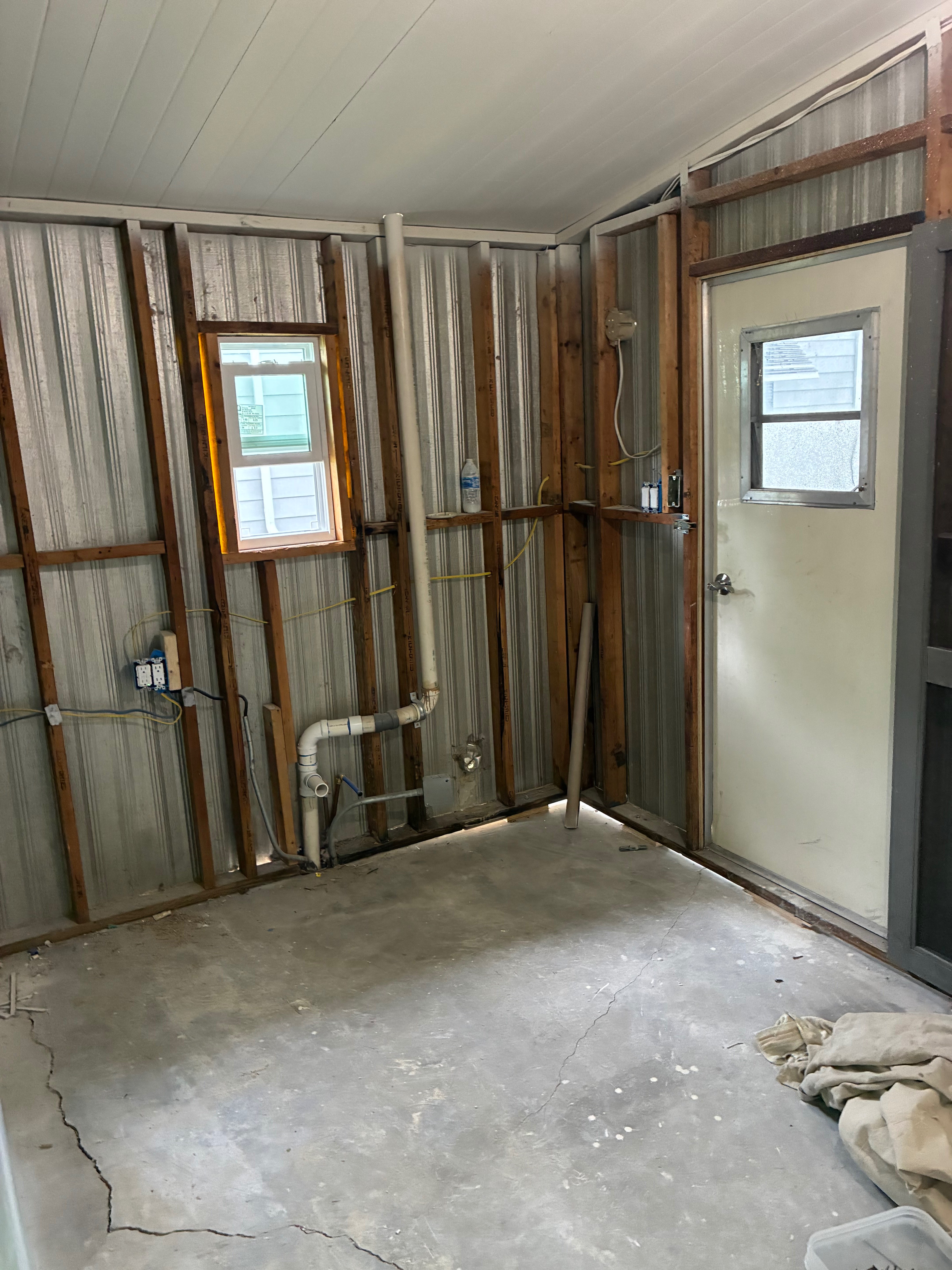 Garage wall repair and drywall - before